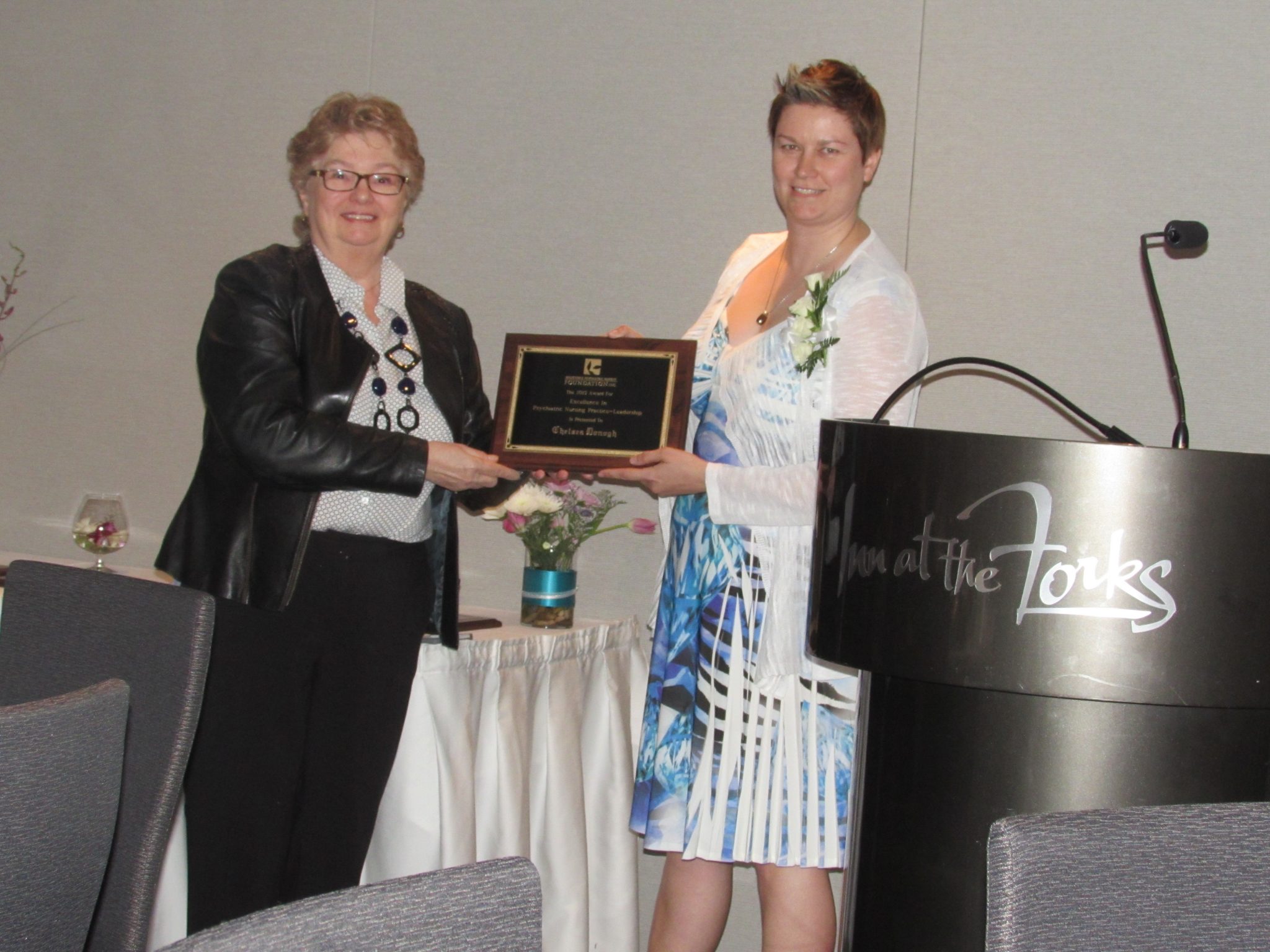 Chelsea Donogh receiving the Award for Excellence in Psychiatric Nursing Practice---Leadership from Annette Thorimbert Osted. (Photo sent in by Serena Yaworski)