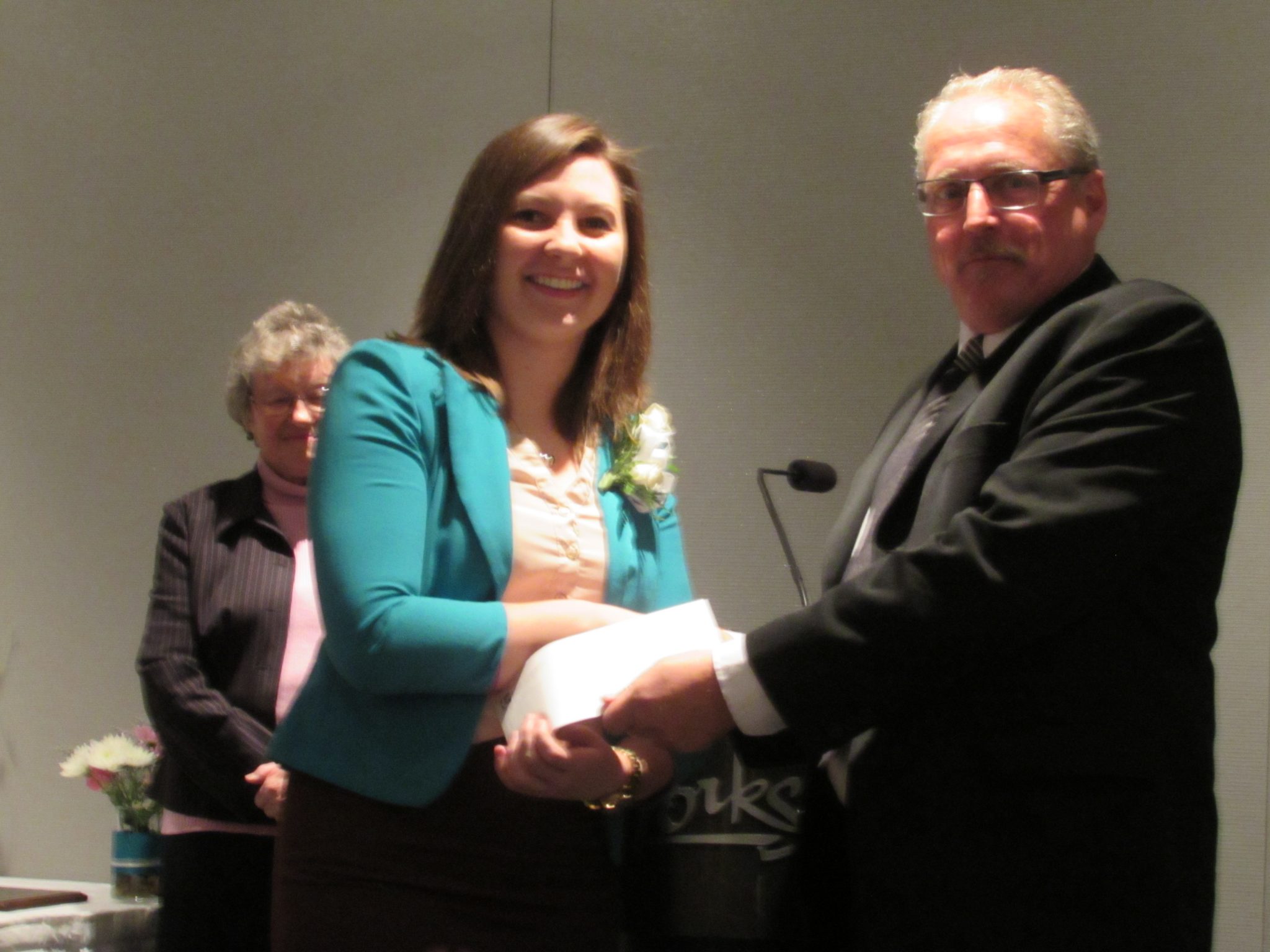 Serena Yaworski receiving the John Kellie Scholarship from John's son, Richard Kellie. (Photo sent in by Serena Yaworski)